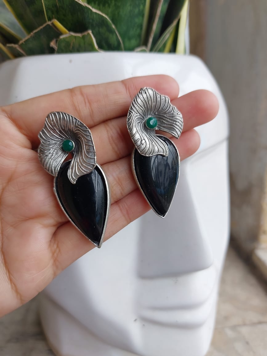 German silver earring its like a silver look a like earring with black stone its light weight too.